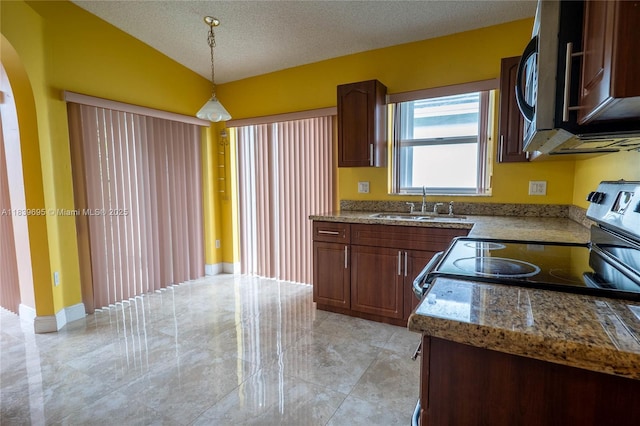 14677 SW 123rd Ave, Miami, FL 33186 - kitchen with appliances with stainless steel finishes, a textured ceiling, pendant lighting, arched walkways, and light stone counters