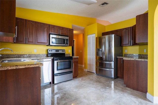 14677 SW 123rd Ave, Miami, FL 33186 - kitchen featuring stainless steel appliances, light stone counters, and lofted ceiling