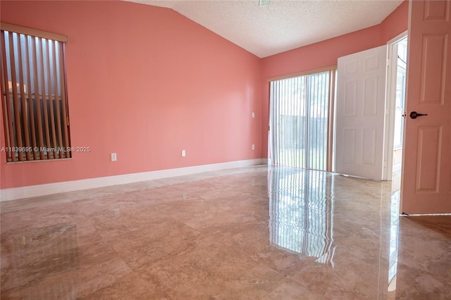 14677 SW 123rd Ave, Miami, FL 33186 - unfurnished room with lofted ceiling and a textured ceiling