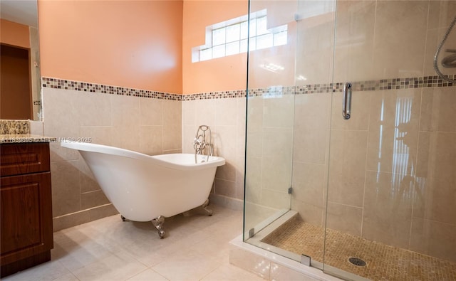 14677 SW 123rd Ave, Miami, FL 33186 - bathroom with tile walls, a stall shower, a freestanding tub, vanity, and a wainscoted wall