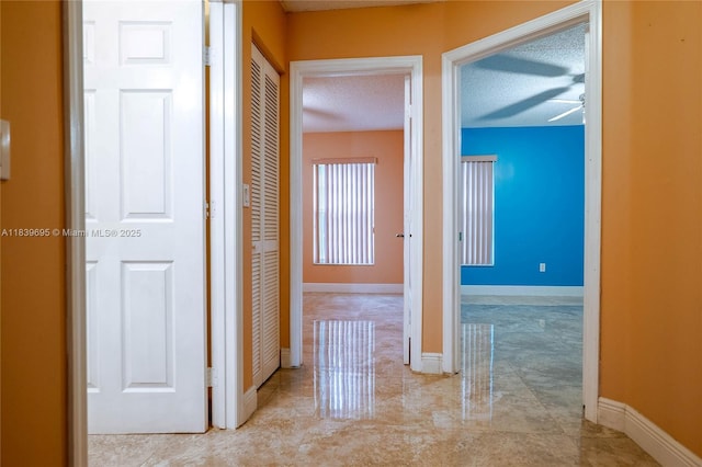 14677 SW 123rd Ave, Miami, FL 33186 - corridor featuring baseboards and a textured ceiling
