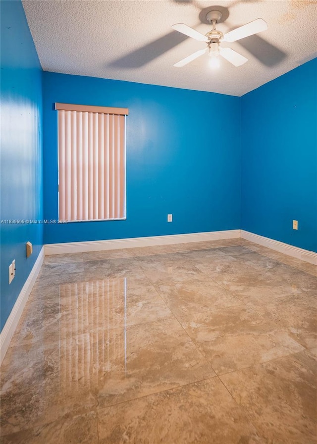 14677 SW 123rd Ave, Miami, FL 33186 - spare room featuring a textured ceiling and a ceiling fan