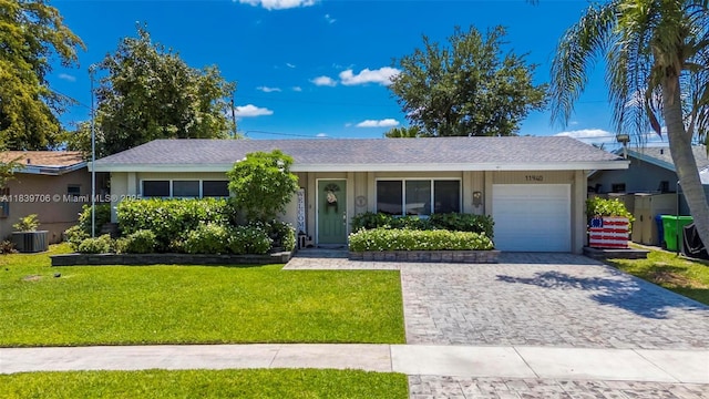 11940 NW 33rd St, Sunrise, FL 33323 - single story home with a garage, decorative driveway, and a front yard