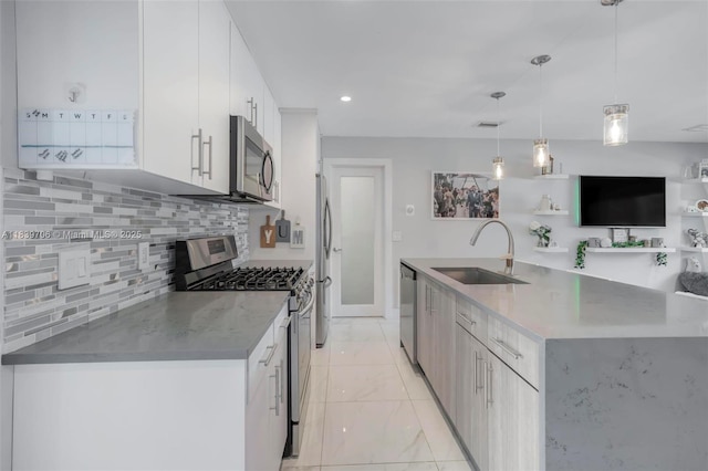 11940 NW 33rd St, Sunrise, FL 33323 - kitchen with appliances with stainless steel finishes, modern cabinets, decorative backsplash, light marble finish floors, and a large island