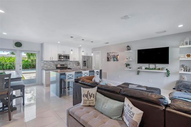 11940 NW 33rd St, Sunrise, FL 33323 - living area with recessed lighting, light tile patterned floors, and french doors