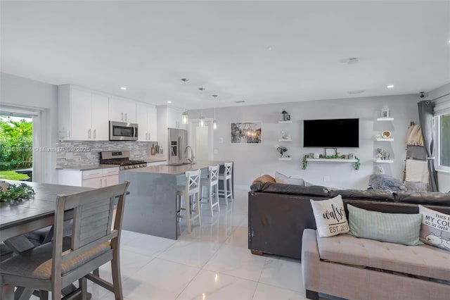 11940 NW 33rd St, Sunrise, FL 33323 - living area with recessed lighting and light marble finish flooring