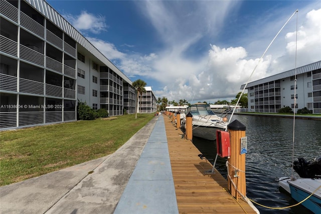 3551 NE 169th St Unit 411, North Miami Beach, FL 33160 - dock area featuring a yard and a water view