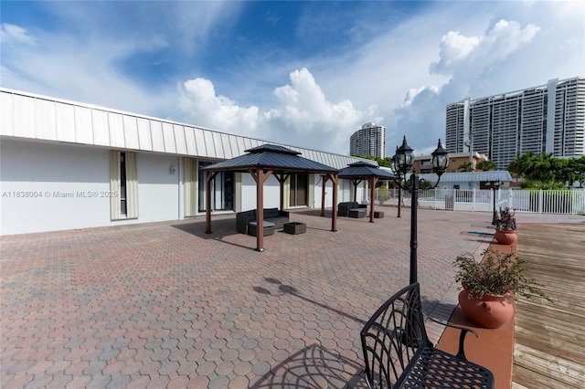 3551 NE 169th St Unit 411, North Miami Beach, FL 33160 - surrounding community featuring a gazebo and a patio