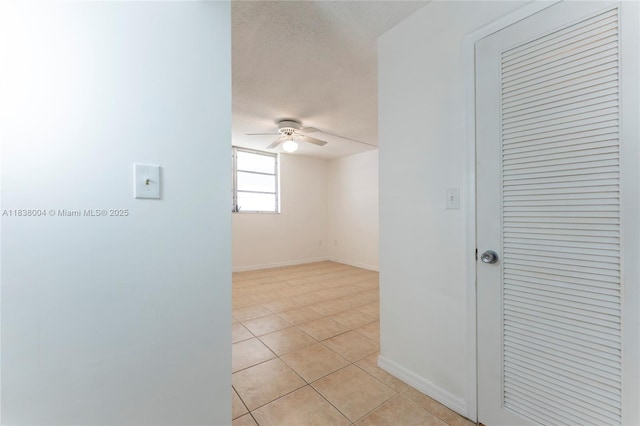 3551 NE 169th St Unit 411, North Miami Beach, FL 33160 - empty room featuring ceiling fan, light tile patterned flooring, and a textured ceiling