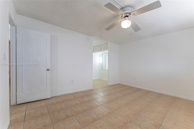 3551 NE 169th St Unit 411, North Miami Beach, FL 33160 - empty room with light tile patterned flooring, a textured ceiling, and ceiling fan