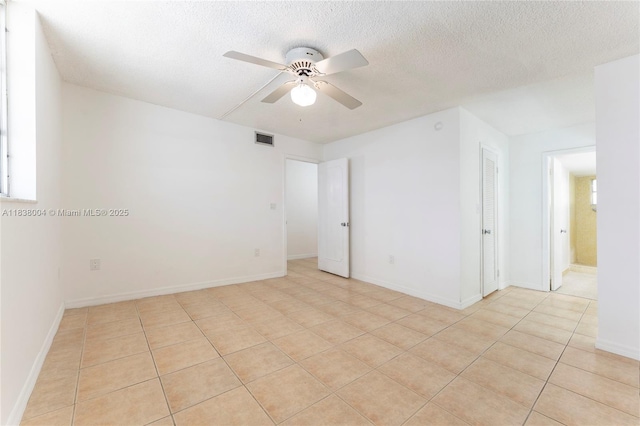 3551 NE 169th St Unit 411, North Miami Beach, FL 33160 - spare room with ceiling fan, light tile patterned floors, and a textured ceiling