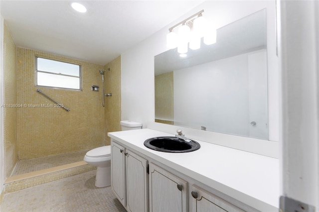 3551 NE 169th St Unit 411, North Miami Beach, FL 33160 - bathroom featuring tiled shower, vanity, and tile patterned floors