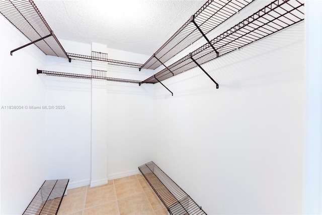 3551 NE 169th St Unit 411, North Miami Beach, FL 33160 - spacious closet featuring light tile patterned flooring