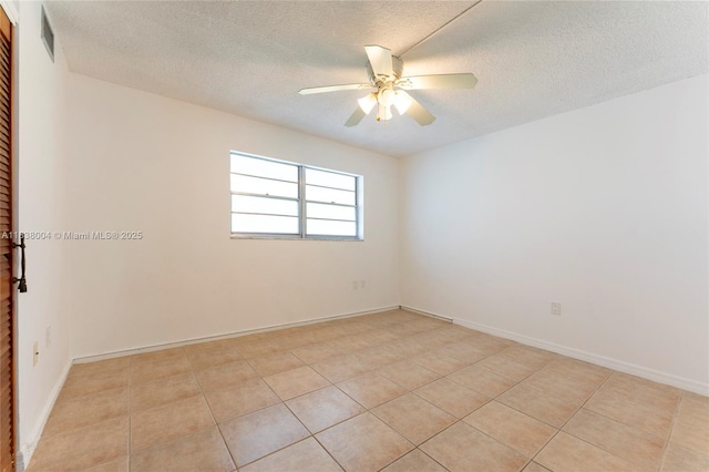 3551 NE 169th St Unit 411, North Miami Beach, FL 33160 - spare room featuring ceiling fan, a textured ceiling, and light tile patterned floors