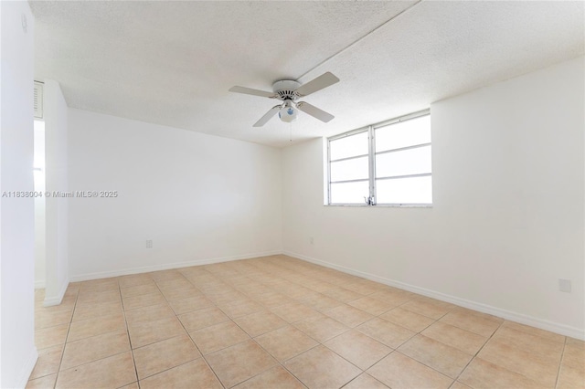 3551 NE 169th St Unit 411, North Miami Beach, FL 33160 - empty room featuring a ceiling fan, a textured ceiling, and light tile patterned flooring