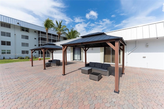 3551 NE 169th St Unit 411, North Miami Beach, FL 33160 - view of patio / terrace with a gazebo and an outdoor living space