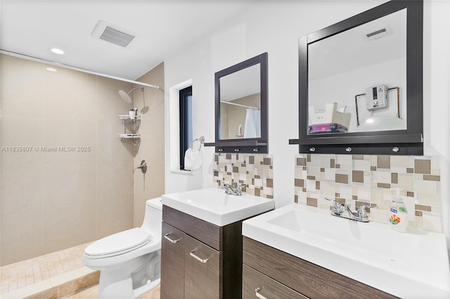 11420 SW 44th St, Miami, FL 33165 - bathroom featuring a tile shower, decorative backsplash, and two vanities