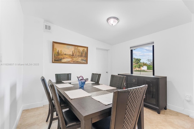 11420 SW 44th St, Miami, FL 33165 - dining space with lofted ceiling and light tile patterned floors
