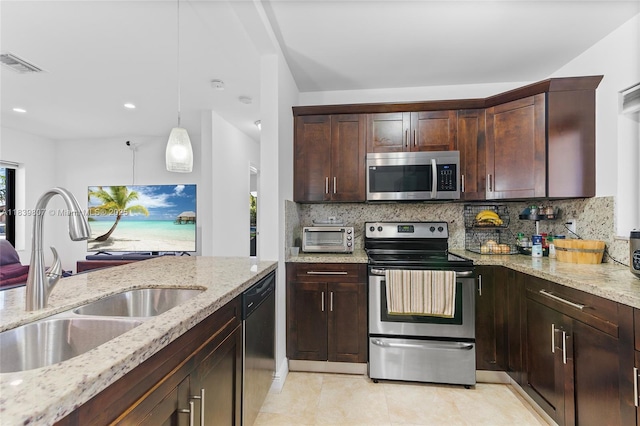11420 SW 44th St, Miami, FL 33165 - kitchen featuring appliances with stainless steel finishes, decorative backsplash, light stone countertops, dark brown cabinets, and recessed lighting