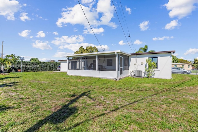 11420 SW 44th St, Miami, FL 33165 - back of house featuring a sunroom and a lawn