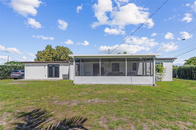 11420 SW 44th St, Miami, FL 33165 - rear view of property with a sunroom, a yard, and french doors