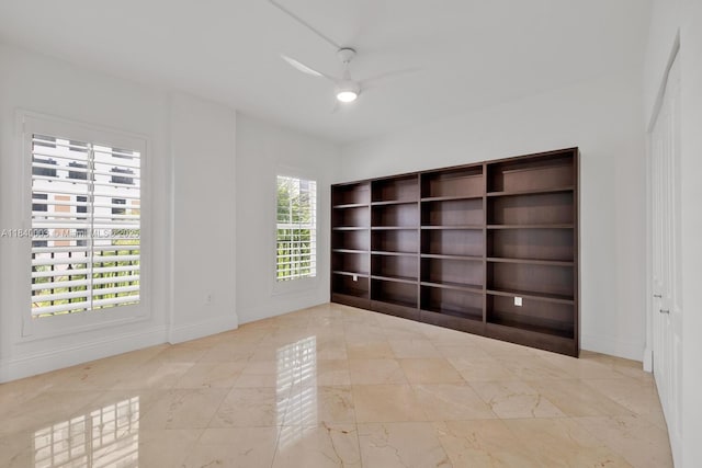 20 Calabria Ave Unit 505, Coral Gables, FL 33134 - empty room with a ceiling fan and marble finish flooring