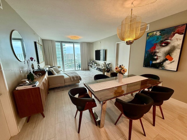 300 Sunny Isles Blvd Unit 4-1806, Sunny Isles Beach, FL 33160 - dining area featuring light wood finished floors and a wall of windows