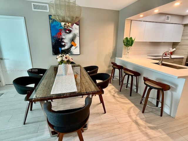 300 Sunny Isles Blvd Unit 4-1806, Sunny Isles Beach, FL 33160 - dining space with recessed lighting, light wood-style flooring, and a chandelier