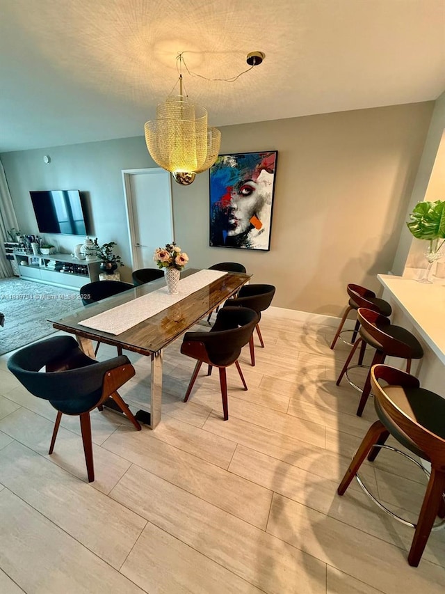 300 Sunny Isles Blvd Unit 4-1806, Sunny Isles Beach, FL 33160 - dining space featuring wood finish floors and a chandelier