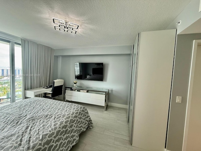 300 Sunny Isles Blvd Unit 4-1806, Sunny Isles Beach, FL 33160 - bedroom featuring a textured ceiling and baseboards