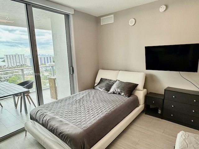 300 Sunny Isles Blvd Unit 4-1806, Sunny Isles Beach, FL 33160 - bedroom featuring access to outside and a city view