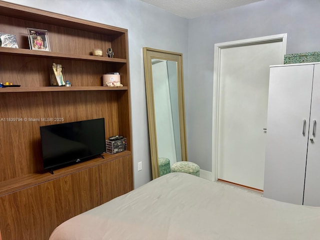 300 Sunny Isles Blvd Unit 4-1806, Sunny Isles Beach, FL 33160 - bedroom with a textured ceiling