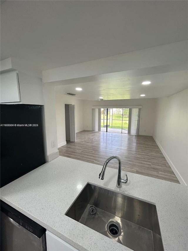 4632 NW 90th Ave, Sunrise, FL 33351 - kitchen featuring open floor plan, dishwasher, light stone counters, wood finished floors, and recessed lighting