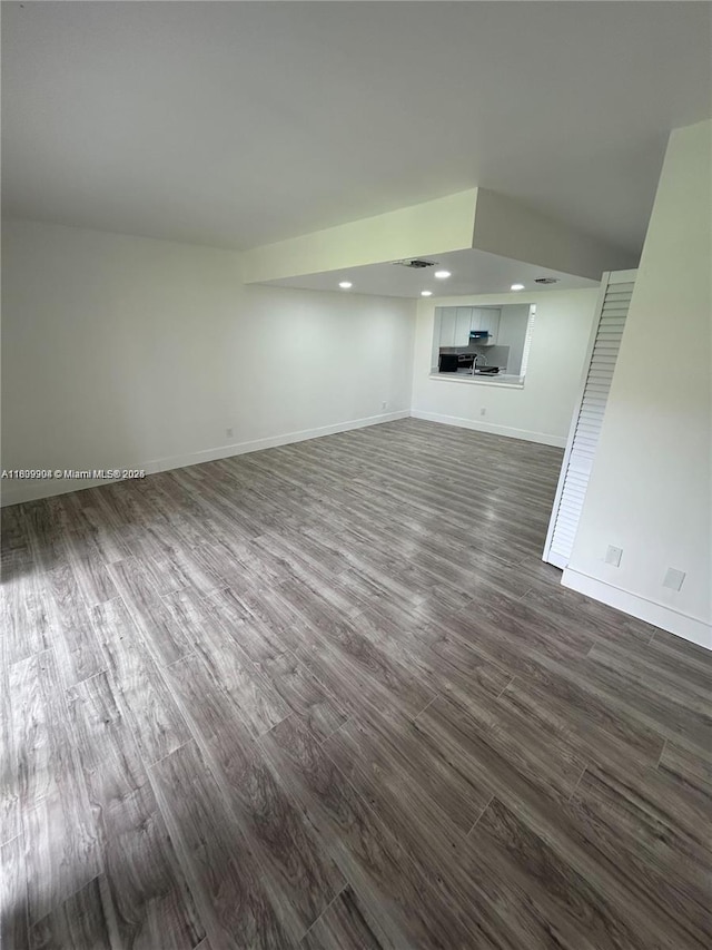 4632 NW 90th Ave, Sunrise, FL 33351 - unfurnished living room with dark wood finished floors and recessed lighting