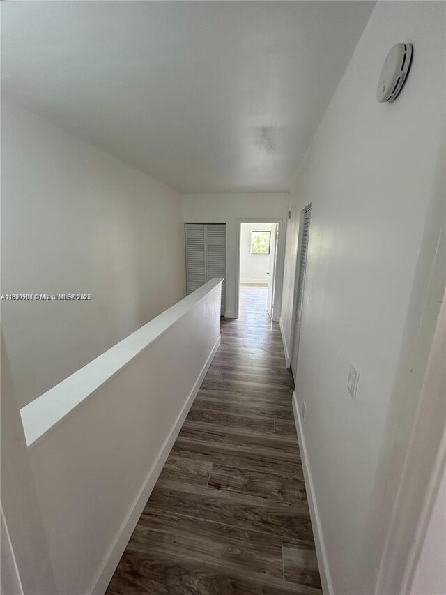 4632 NW 90th Ave, Sunrise, FL 33351 - corridor featuring baseboards and dark wood-style flooring