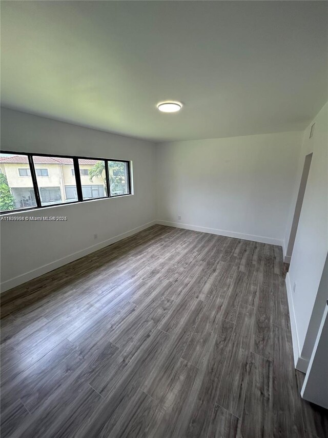 4632 NW 90th Ave, Sunrise, FL 33351 - unfurnished room featuring dark wood-type flooring and baseboards