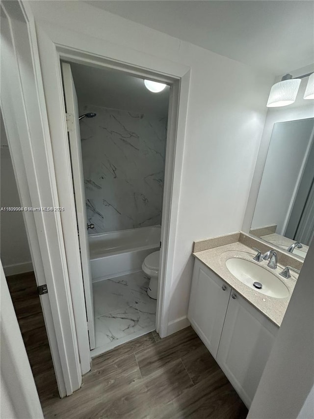 4632 NW 90th Ave, Sunrise, FL 33351 - bathroom featuring vanity, marble look tile flooring, and shower / washtub combination