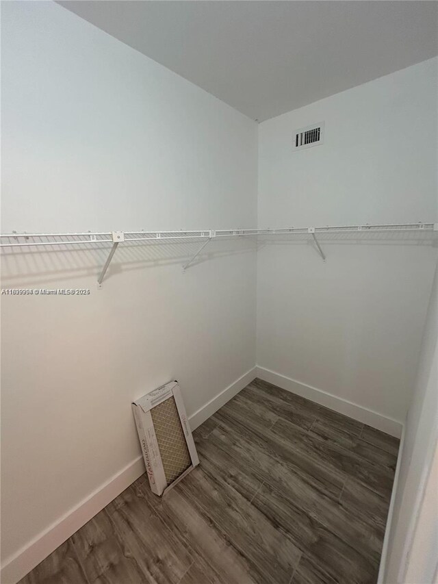 4632 NW 90th Ave, Sunrise, FL 33351 - walk in closet featuring dark wood-type flooring