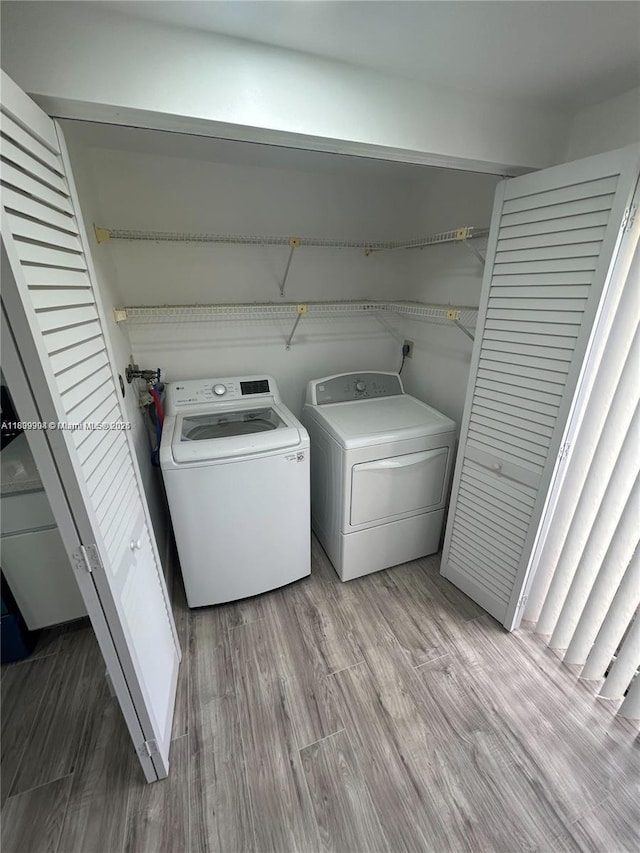 4632 NW 90th Ave, Sunrise, FL 33351 - washroom featuring washer and dryer and light wood-style floors