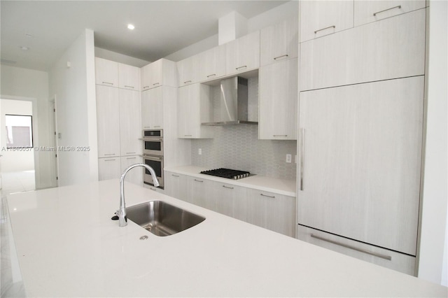 8074 NW 43rd St, Doral, FL 33166 - kitchen featuring wall chimney range hood, modern cabinets, tasteful backsplash, light countertops, and cooktop
