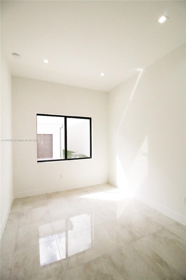 8074 NW 43rd St, Doral, FL 33166 - tiled spare room featuring recessed lighting