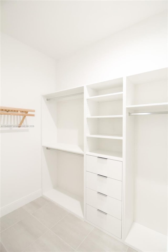 8074 NW 43rd St, Doral, FL 33166 - spacious closet with light tile patterned flooring