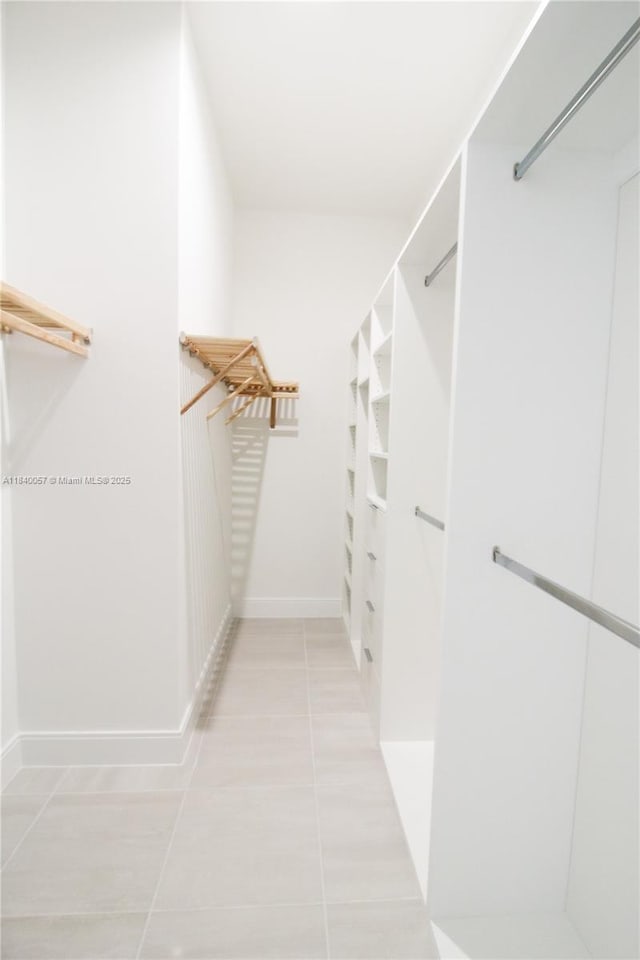 8074 NW 43rd St, Doral, FL 33166 - walk in closet featuring light tile patterned flooring