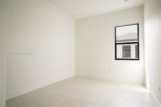 8074 NW 43rd St, Doral, FL 33166 - spare room with light tile patterned floors and baseboards