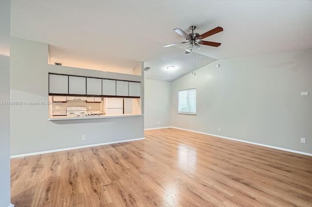 10897 Grandview Ct, Royal Palm Beach, FL 33411 - unfurnished living room with ceiling fan, light wood-style flooring, and lofted ceiling