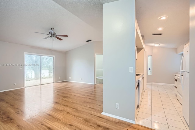 10897 Grandview Ct, Royal Palm Beach, FL 33411 - empty room featuring ceiling fan, vaulted ceiling, light wood-type flooring, a textured ceiling, and recessed lighting