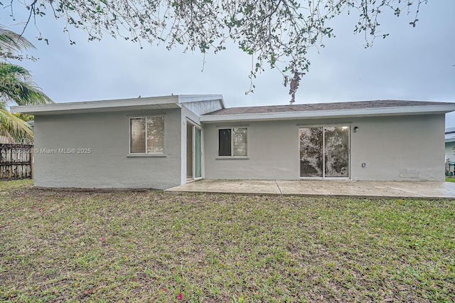 10897 Grandview Ct, Royal Palm Beach, FL 33411 - back of property with stucco siding and a patio