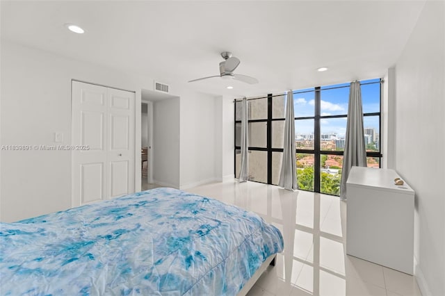 18181 NE 31st Ct Unit 1401, Aventura, FL 33160 - bedroom featuring recessed lighting, light tile patterned floors, floor to ceiling windows, a closet, and ceiling fan