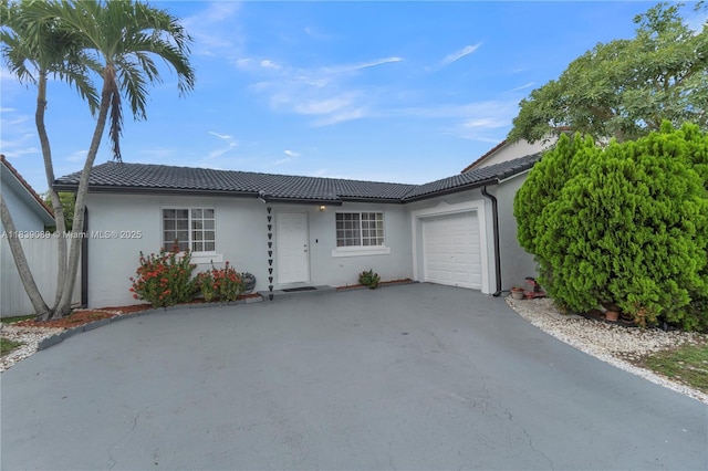 18030 SW 153rd Ct, Miami, FL 33187 - ranch-style house featuring a garage, driveway, a tile roof, and stucco siding