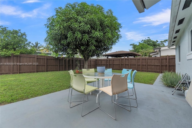 18030 SW 153rd Ct, Miami, FL 33187 - fenced backyard with a patio and outdoor dining space